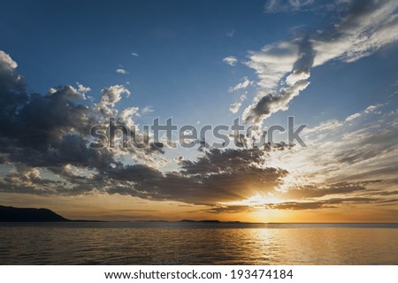 Orcas Island Sunset. A beautiful sunset seen across Rosario Strait from Lummi Island to Orcas Island in the Puget Sound area of western Washington State.