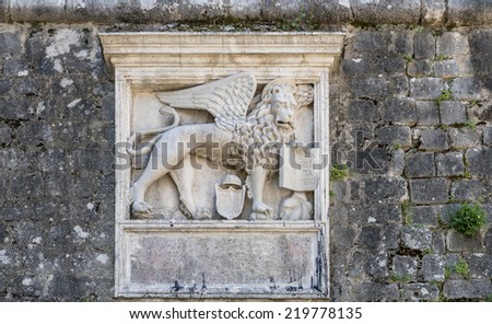 Stone bas-relief of the Venetian lion on the fortress wall. Coat of Arms of Kotor