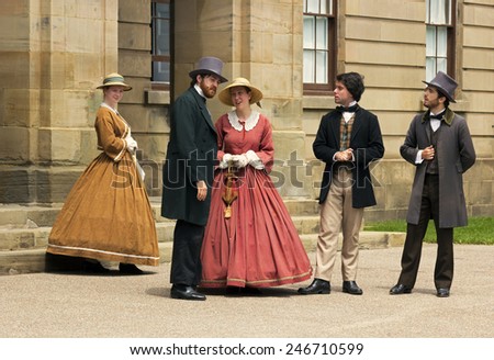 CHARLOTTETOWN, PRINCE EDWARD ISLAND/CANADA - JULY 07, 2014: Actors dressed as Fathers and Ladies of Confederation in front of the Province House in Charlottetown in Prince Edward Island in Canada.