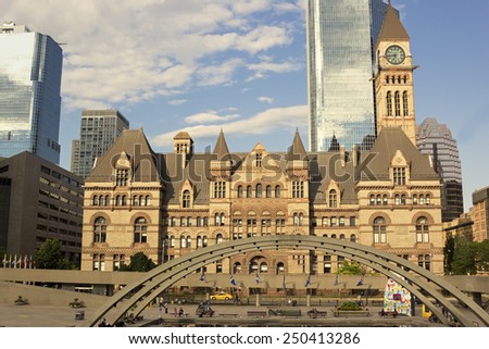 TORONTO, CANADA - JULY 15, 2014: People on Nathan Phillips Square in front of the Old City Hall in Toronto in Canada.