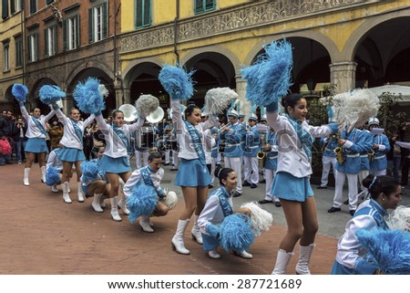 PISA, TUSCANY/ITALY - MARCH 29, 2015: Dancers and orchestra on streets of Pisa in Italy.