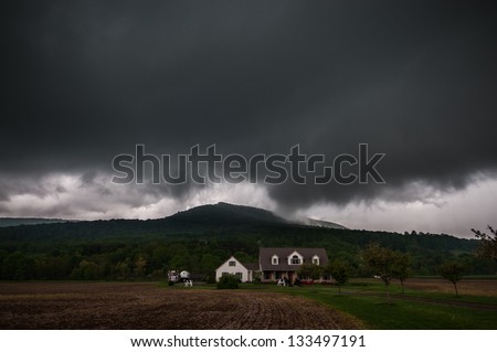 A severe thunderstorm over a house in the Pennsylvania mountains.