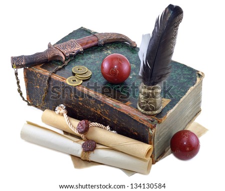 Old book with knife, manuscripts and red balls isolated