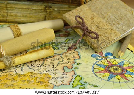 Diary with map and paper scrolls