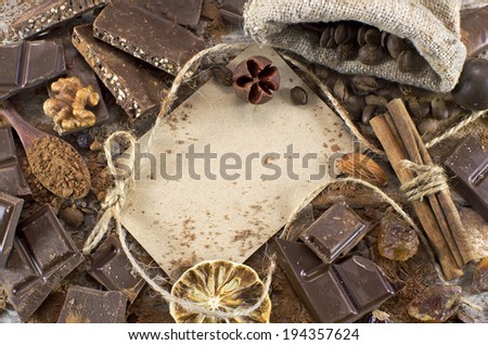 Chocolate still life with chocolate mix, greeting card and spices