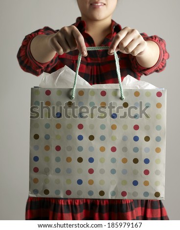 Mid-Adult Woman Holding Shopping Bag