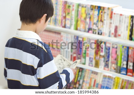boy browsing at convenience store