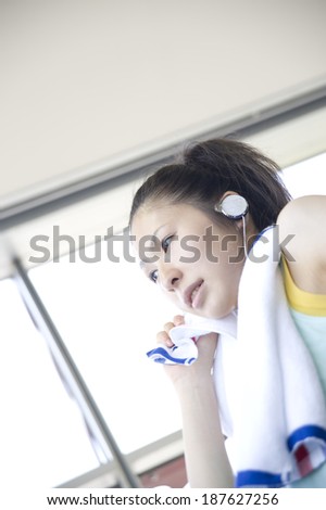 woman wiping sweat