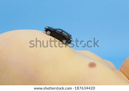 stomach of metabolic syndrome man with toy car on it