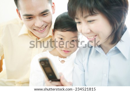 Family looking at a mobile phone