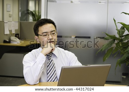 young asian business executive working in office