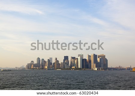 manhattan skyline from the back of a ferry boat, new york.