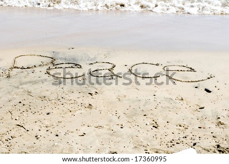 Peace written on the beach on a sunny day at Lake Michigan.