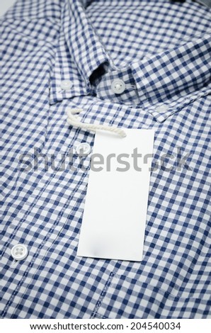 Folded shirt with white tag