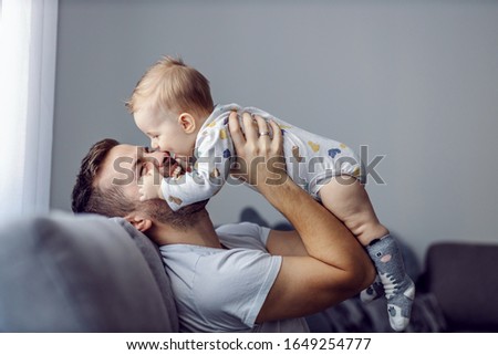 Similar – Foto Bild Kleiner blonder Junge in Winter-Oberbekleidung im Freien