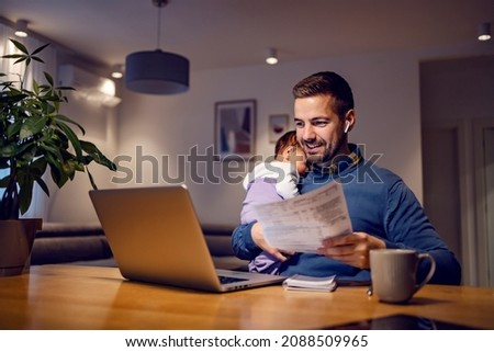 Image, Stock Photo Dad working on laptop with child sitting on his lap