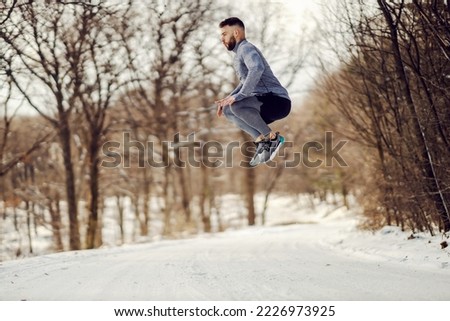 Similar – Image, Stock Photo Strong sportsman jumping and running against blue sky