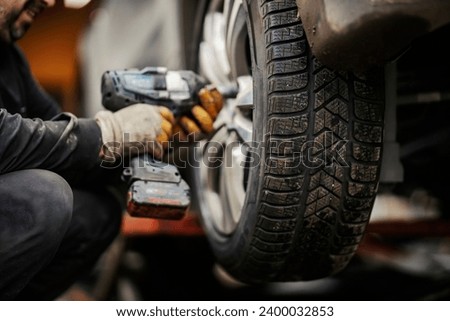 Similar – Image, Stock Photo Crop worker assembling mechanism in workshop