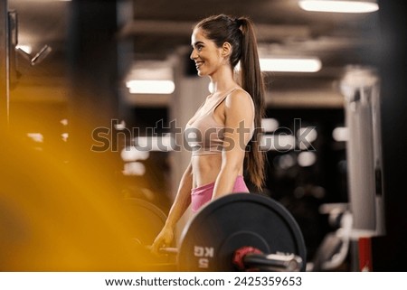 Image, Stock Photo Sportswoman doing exercise with dumbbells