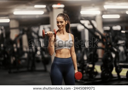 Similar – Image, Stock Photo Sportswoman doing exercise with dumbbells