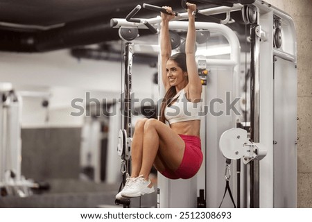 Similar – Image, Stock Photo Female athlete doing pull up exercises