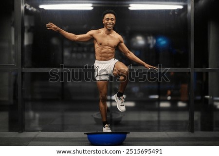 Similar – Image, Stock Photo Ethnic sportsman standing and looking at camera on street