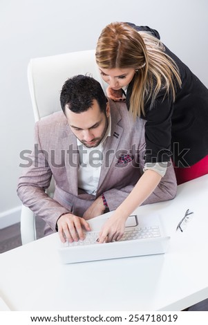 Two people sharing computer knowledge. Learning concept.