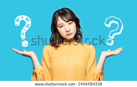 Young woman comparing with two things. Photo stock © 