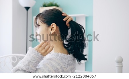 Similar – Image, Stock Photo Young Woman Tying Back Hair and Smiling in Bathroom