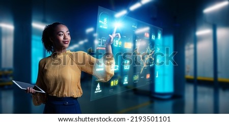 A female engineer in the near future who operates a hologram screen Foto stock © 