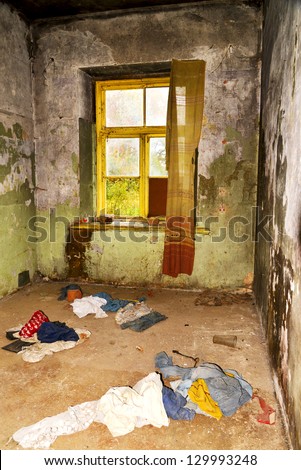 dirty room with tatters in abandoned house