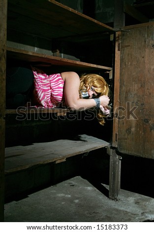 a young adult female stored away by kidnappers tied up on a shelf