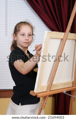 one child in black painting on a canvas