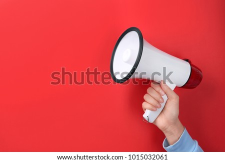Woman holding megaphone on color background Stock foto © 