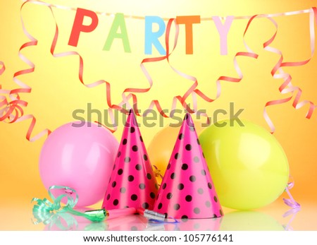 Party items on orange background