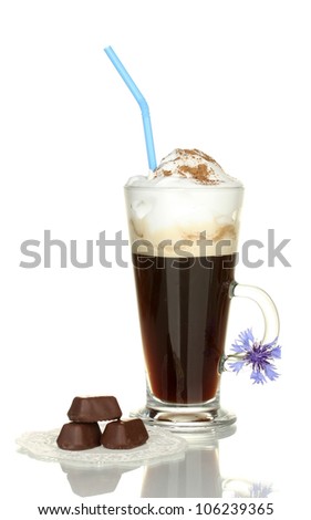 glass of coffee cocktail with chokolate candies on doily and flower isolated on white