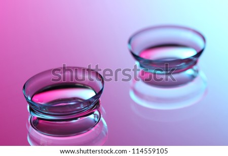 contact lenses, on pink-blue background