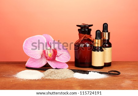 Vanilla pods, vanilla and vanilla sugar on colorful background close-up