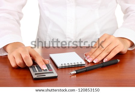 Woman\'s hands counts on the calculator, close-up