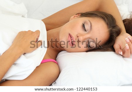 young beautiful woman sleeping in bed