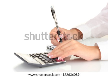 Woman\'s hands counts on the calculator, on white background close-up