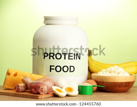 jar of protein powder and food with protein, on green background