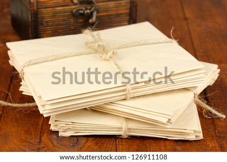 Stacks of old letters on wooden table
