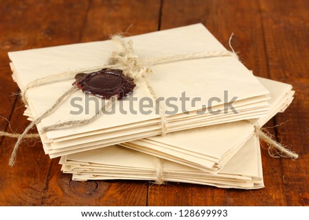 Stacks of old letters on wooden table