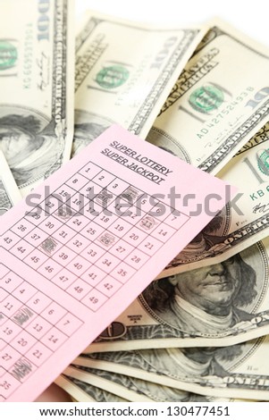 Lottery ticket and money, close up