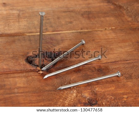 Nails on wooden table close-up