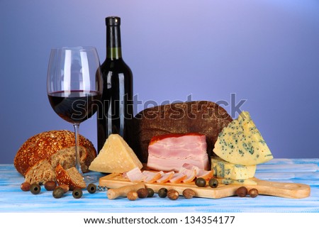 Exquisite still life of wine, cheese and meat products