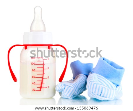 Bottle for milk formula with booties isolated on white