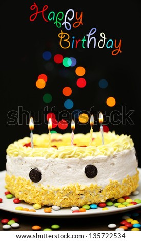 Happy birthday cake, on black background