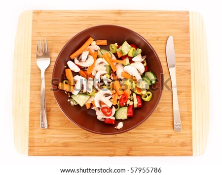 Vegetables mix in plate with knife and fork